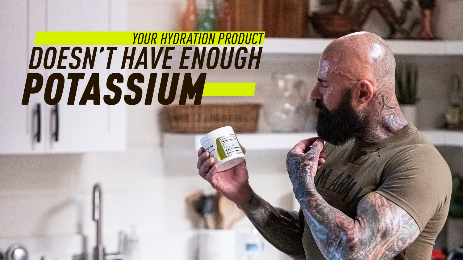 Muscular tattooed man examines supplement facts panel on hydration powder jar in home kitchen, potassium article title overlay.
