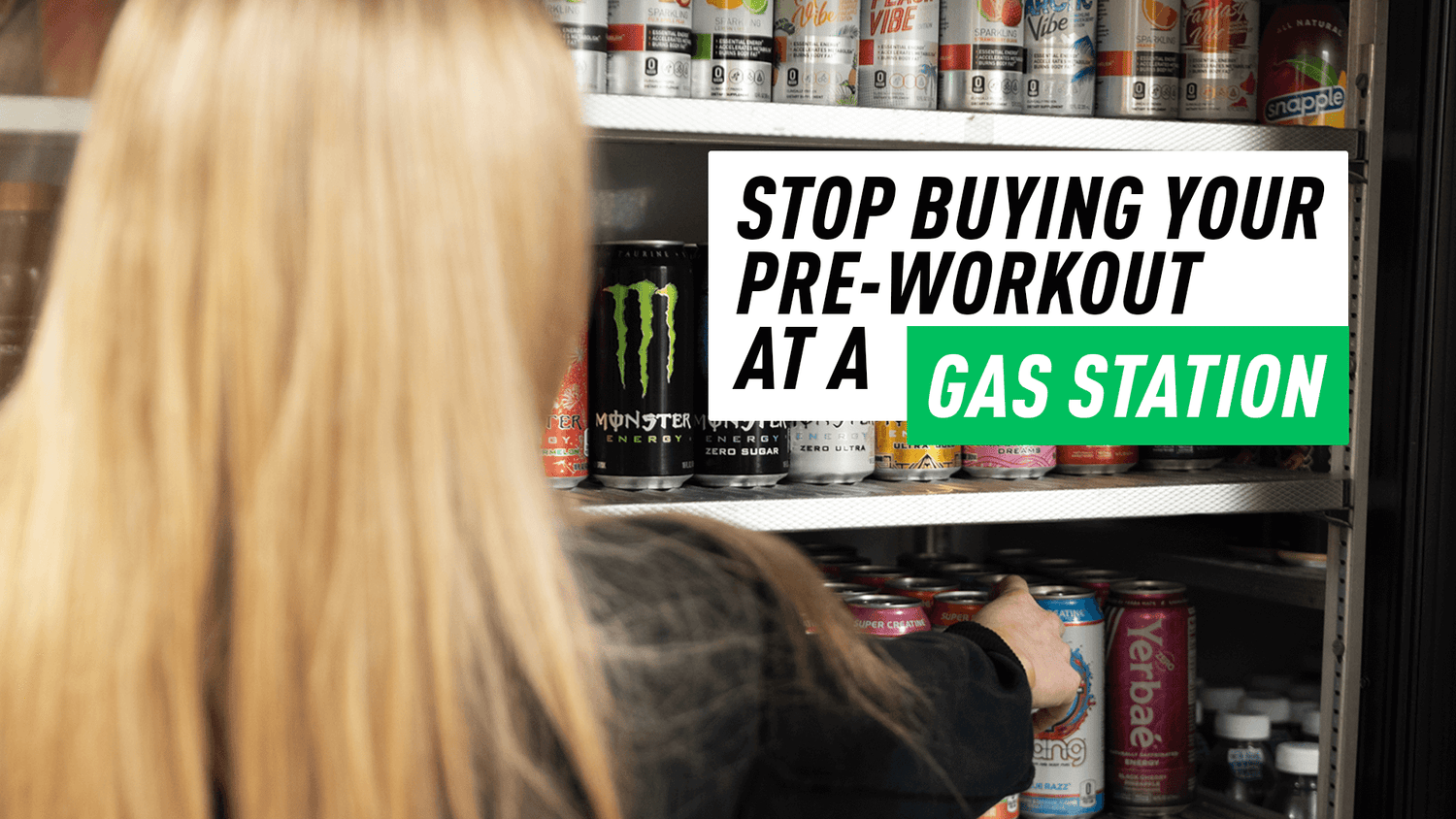 Over-the-shoulder view of woman facing cooler shelves of canned energy drinks for Stop Buying Your Pre-Workout at a Gas Station.