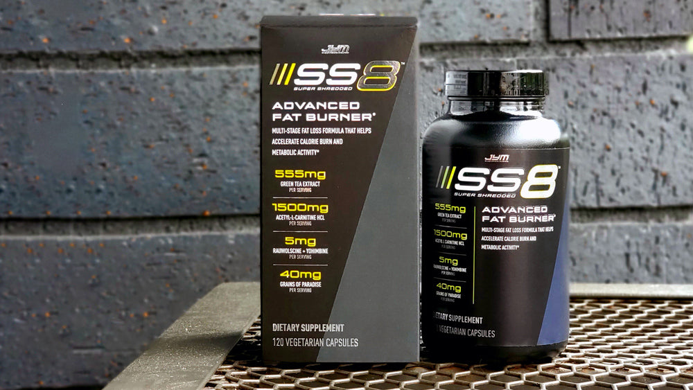 SS8 Advanced Fat Burner box and bottle side by side on a metal grate against a dark brick wall, showing ingredient panel.