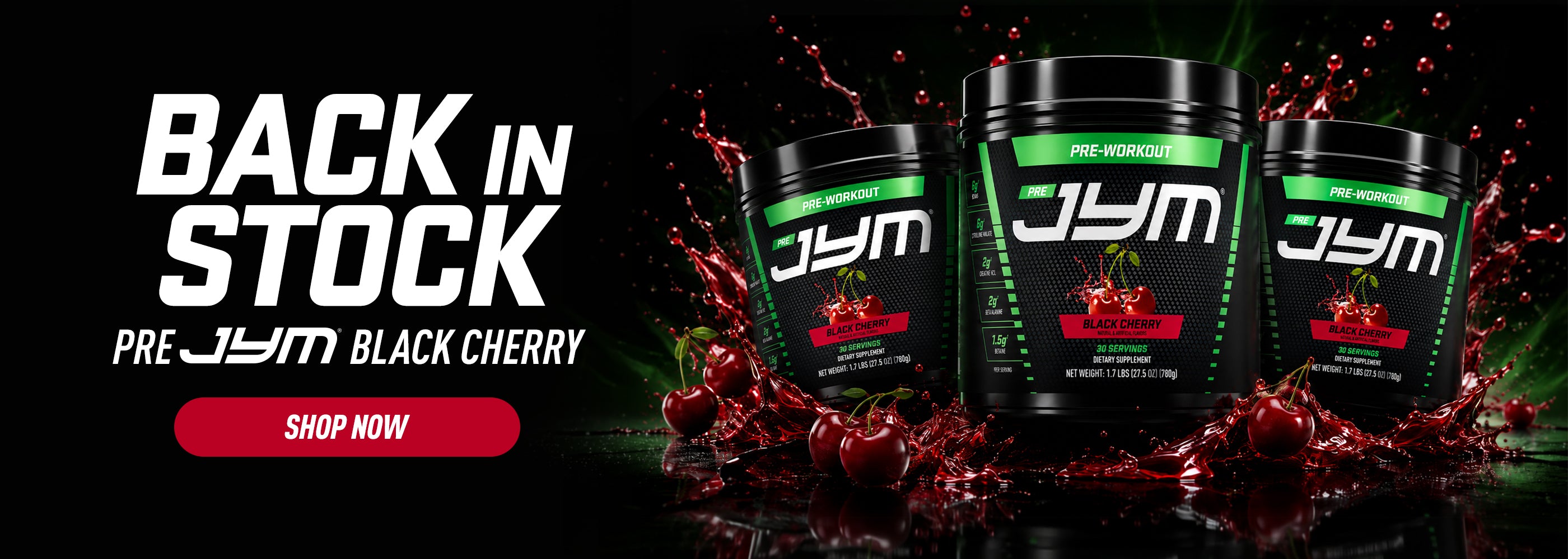 Three black JYM pre-workout supplement containers with green and red labels are shown against a dark background with a red cherry splash effect. Large white text on the left reads 'BACK IN STOCK' and 'PRE JYM BLACK CHERRY' with a red 'SHOP NOW' button below.